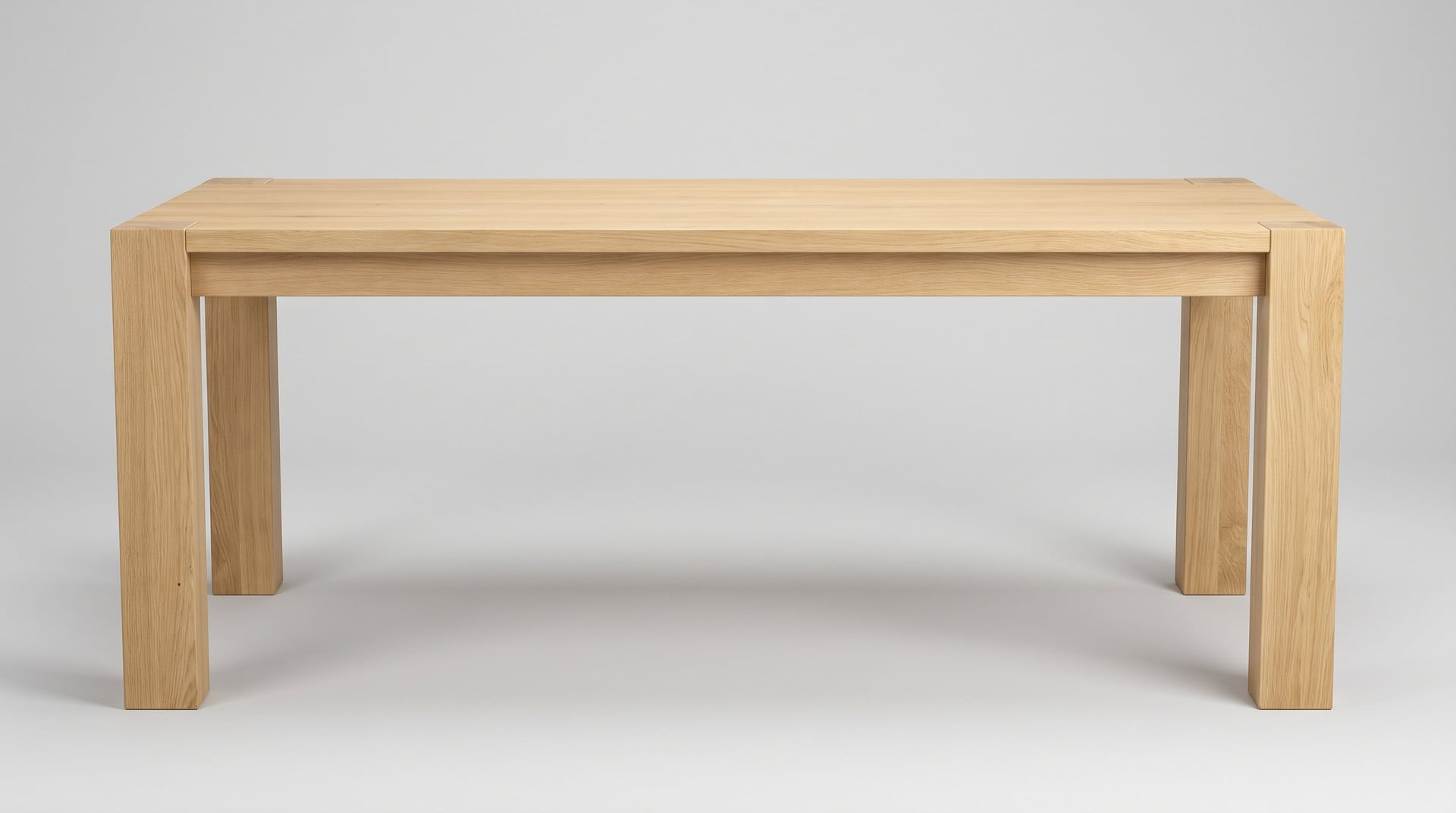 Balkan Dining Table in European oak, studio end view, the two posts and the band under the top