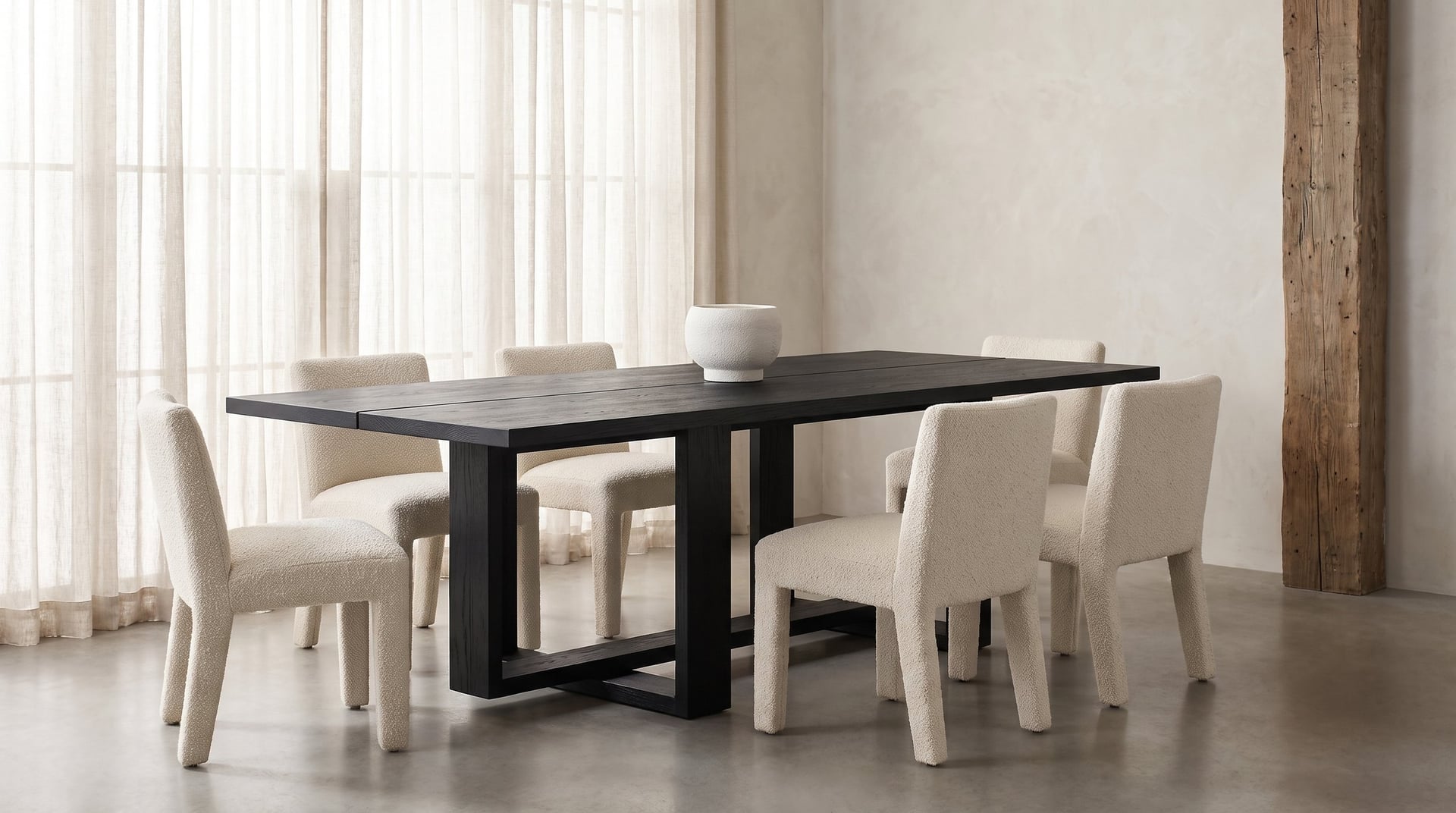 Tesseract Dining Table in black oak, the linen loft from slightly above, six boucle chairs