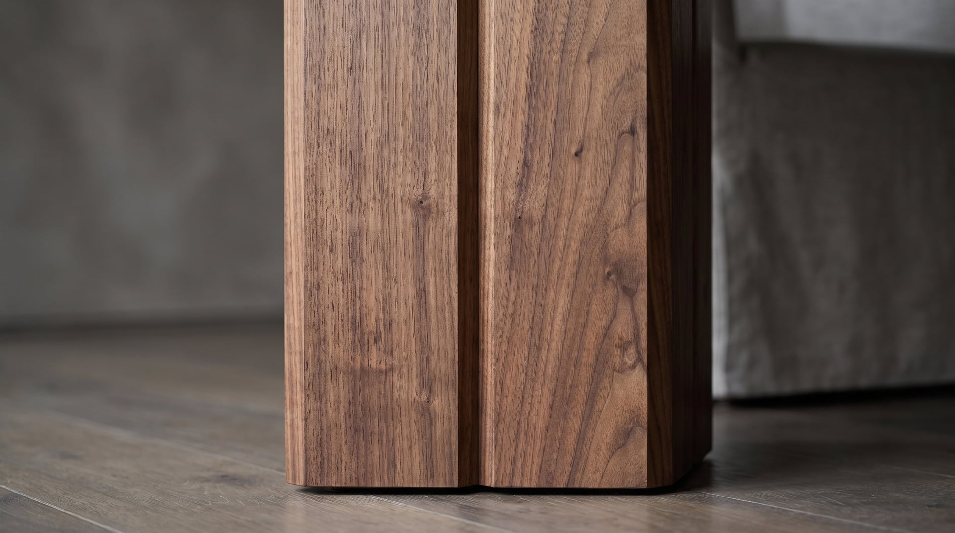 Vekt Walnut Dining Table, the column's chamfered facets, macro