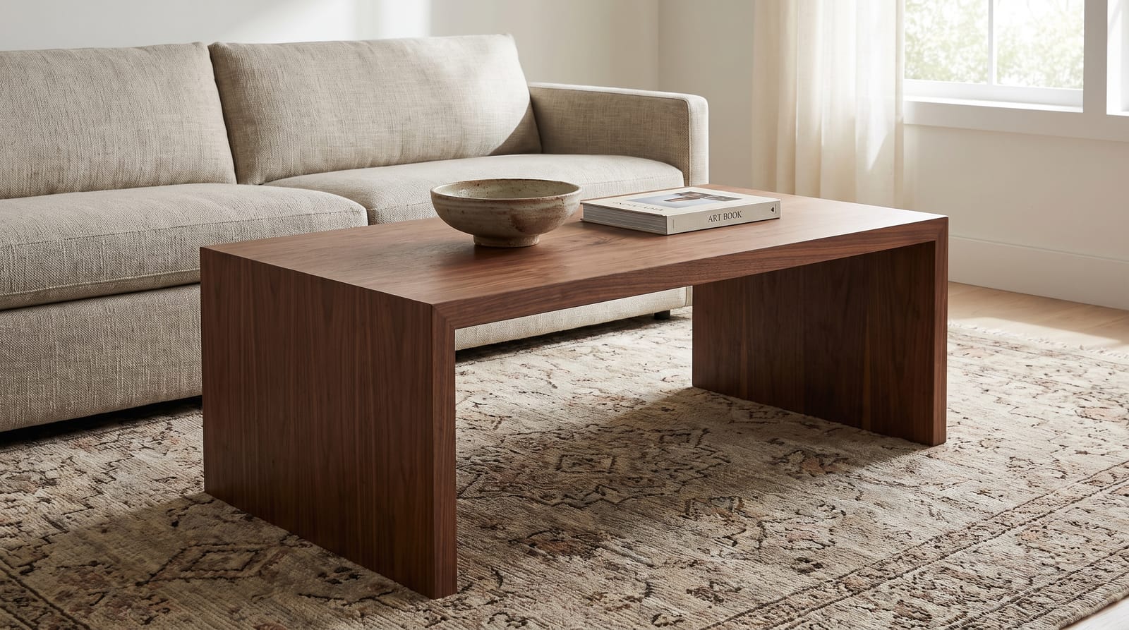 Solid walnut waterfall coffee table in a living room, both ends folded to the floor