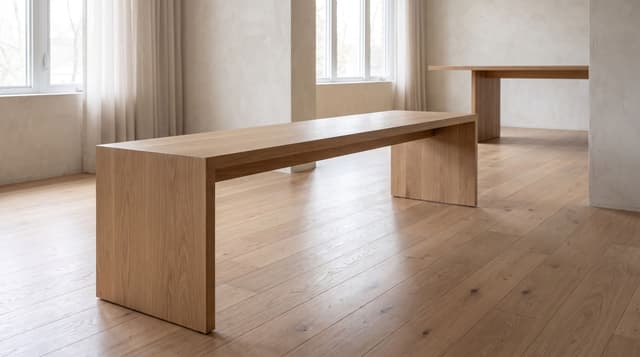 A dining room, white oak waterfall bench with both ends folded to the floor