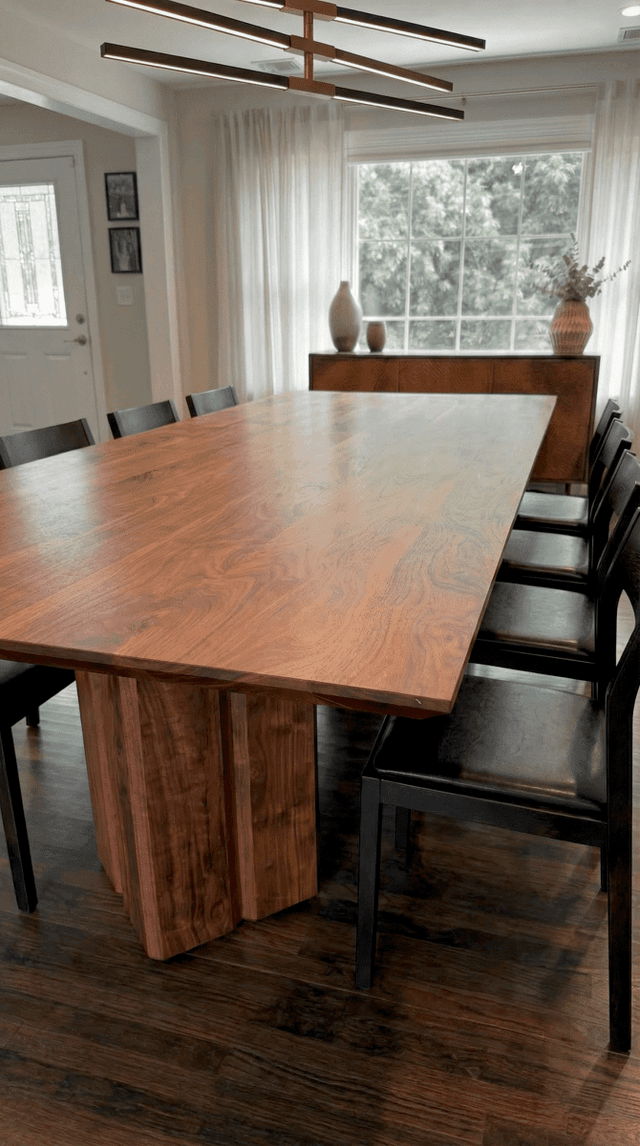 The Vekt Walnut Dining Table in a dining room