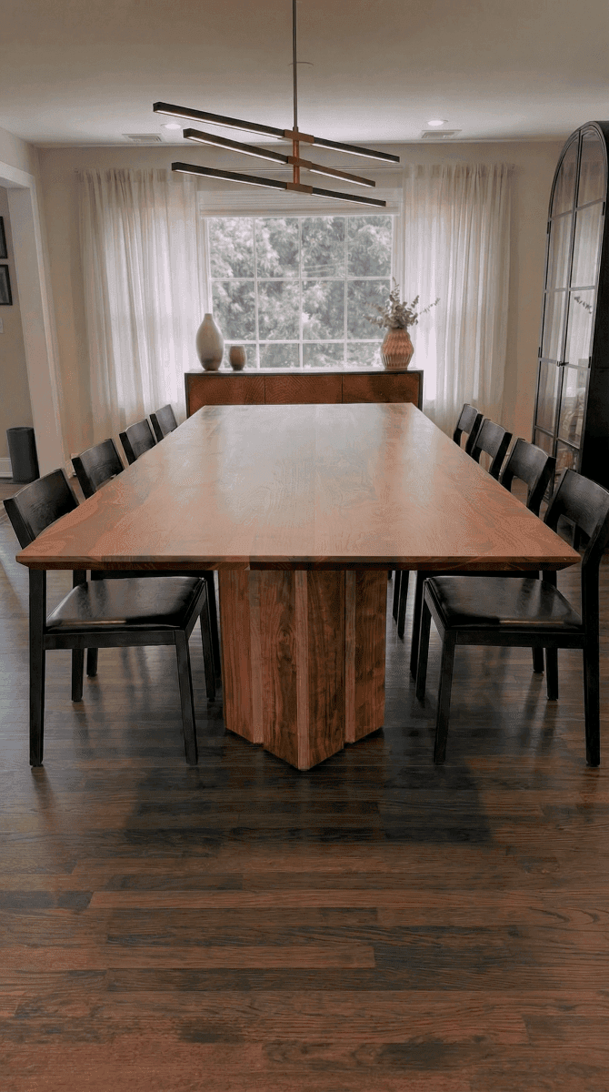 Solid walnut dining table, face grain — the Vekt Walnut Dining Table in a dining room