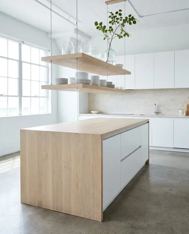 Arctic Oak countertop — a bright minimalist kitchen, island with matching shelves