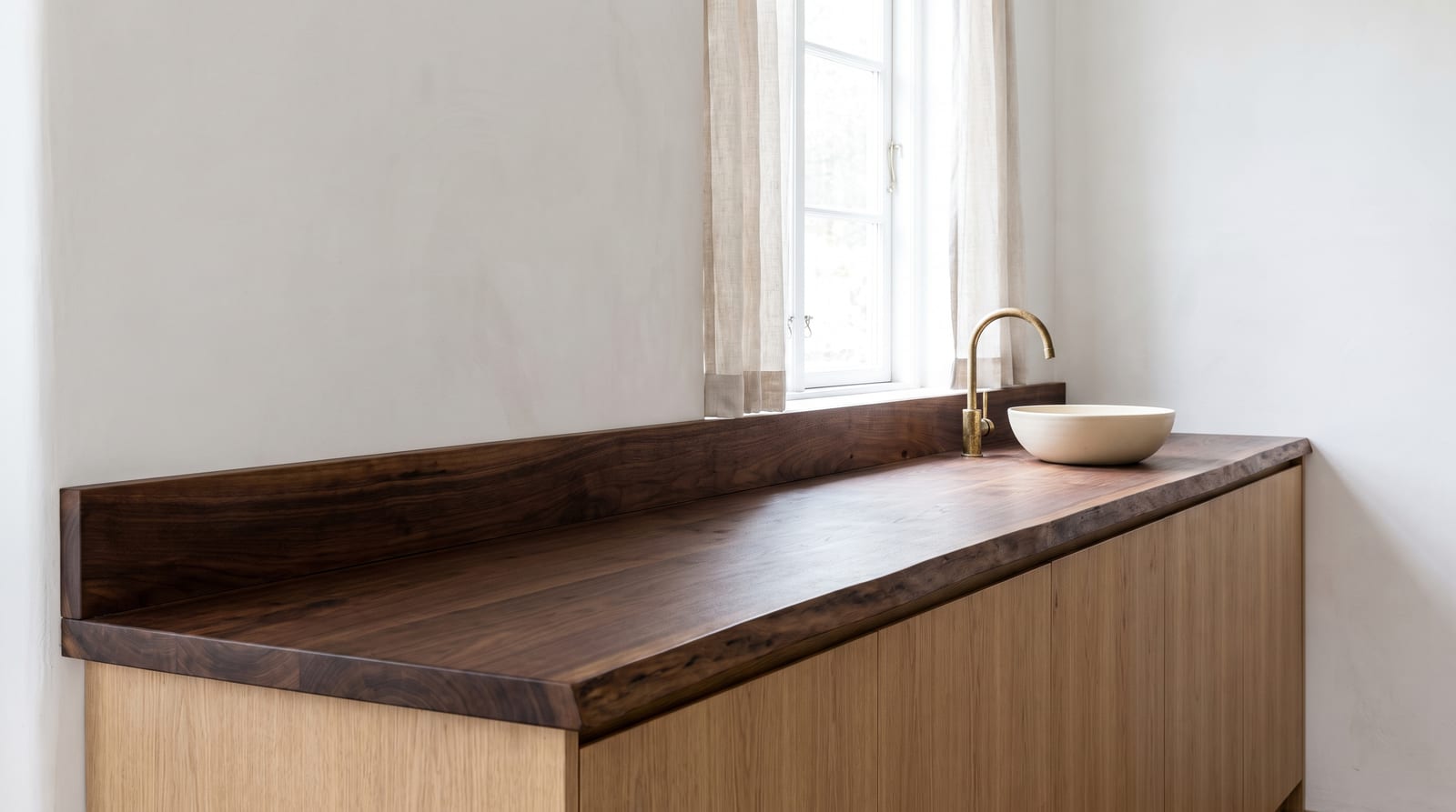 Solid walnut countertop, live edge — a modern kitchen, walnut counter with the live edge on the room side