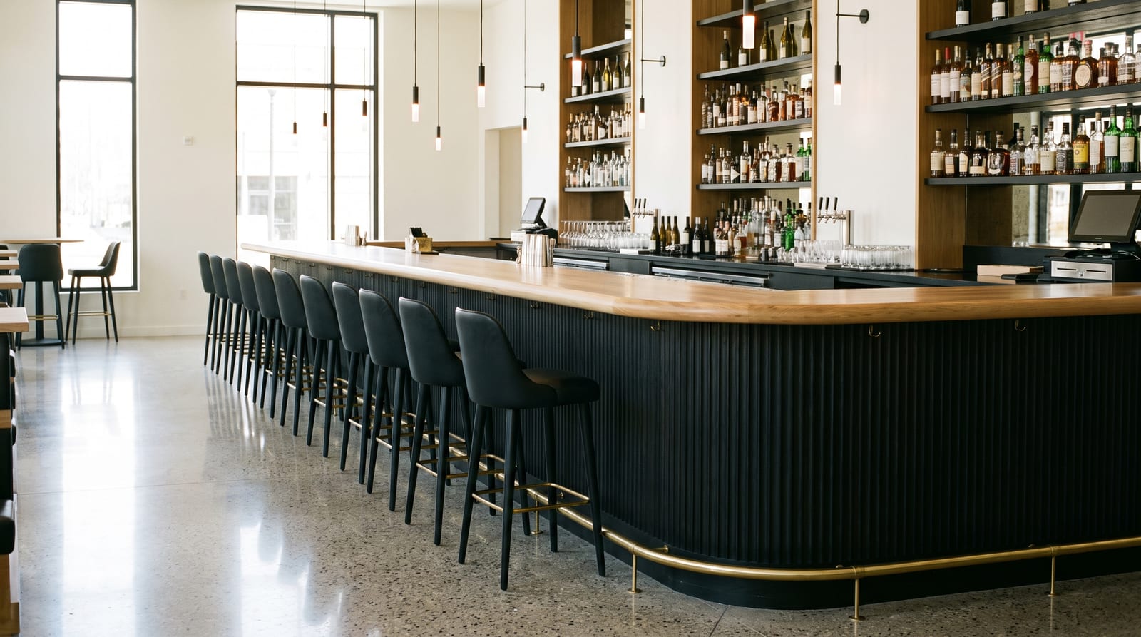 Solid white oak countertop, face grain — a modern restaurant bar, white oak bar top with a brass rail