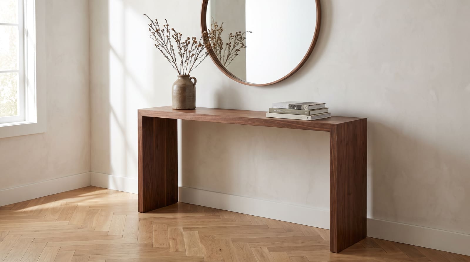 Solid walnut tabletop, face grain — an entryway, walnut waterfall console under a round mirror