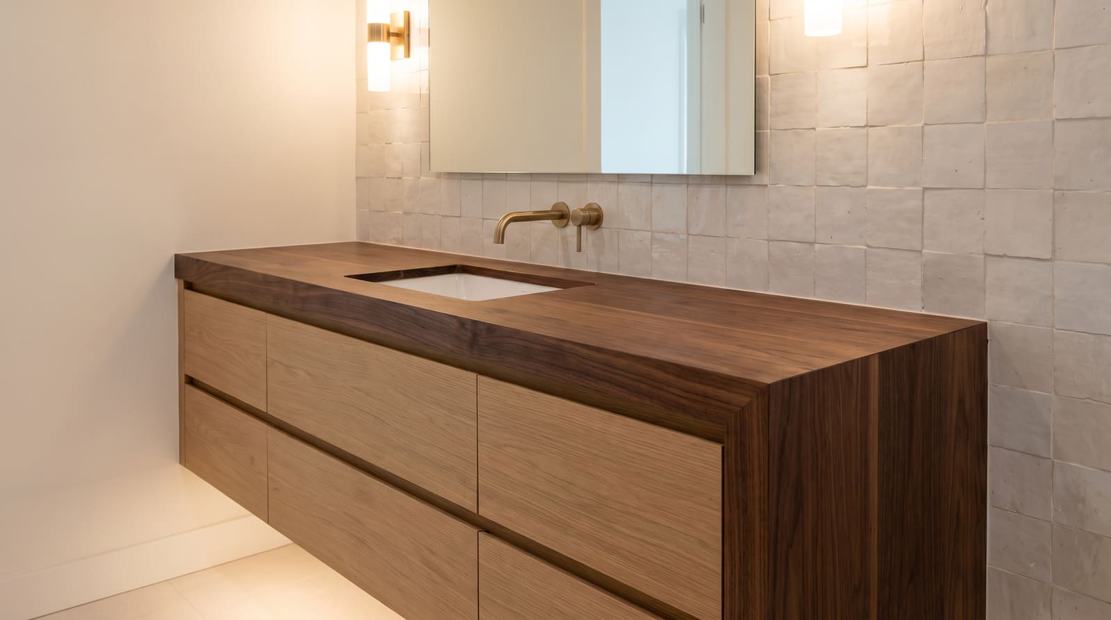 Solid walnut countertop, face grain — a modern bathroom, walnut vanity top with a waterfall end over a floating oak vanity